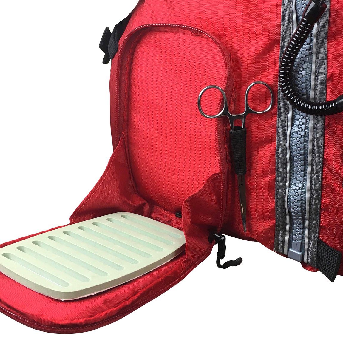Close-up of red Stohlquist kayaking life jacket with zippered pocket and fishing tool holder